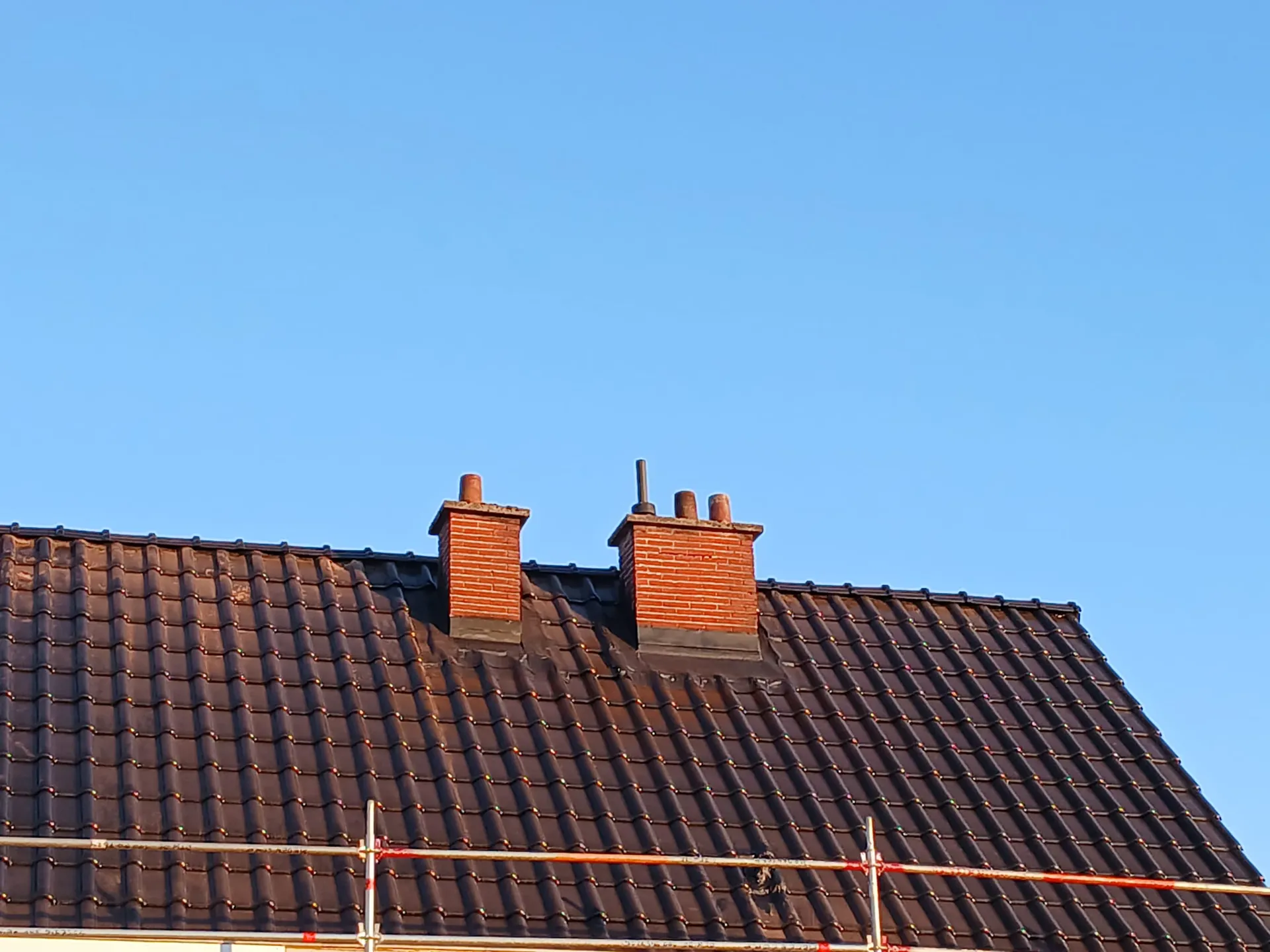 Renovatie van een pannendak op een rijwoning in Gent